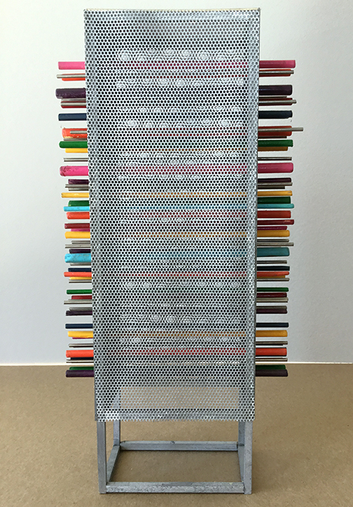 Tall silver structure with brightly colored sticks poking out both sides